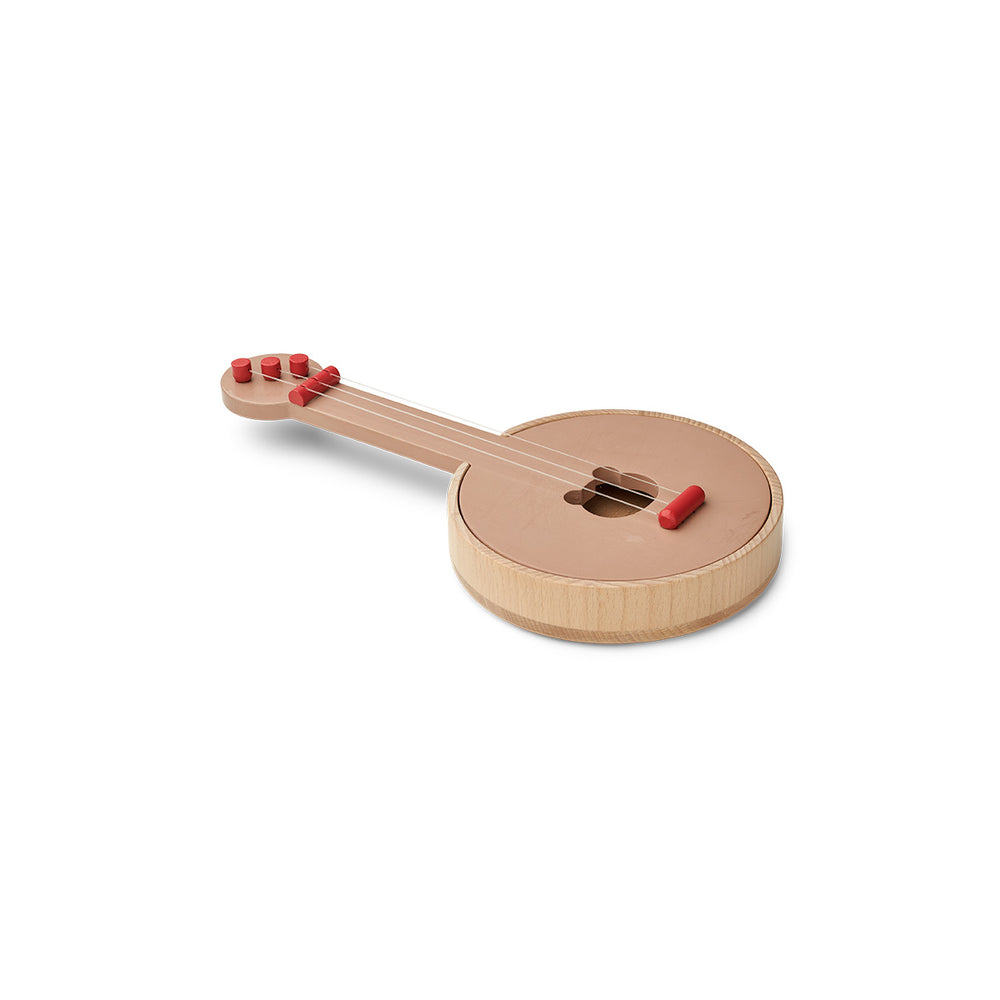 Is jouw kind een echte muzikant? Met de houten banjo chas apple red/tuscany rose van Liewood kan jouw kindje een echt optreden geven. Deze speelgoedbanjo is een eyecatcher in de kinderkamer of woonkamer. VanZus