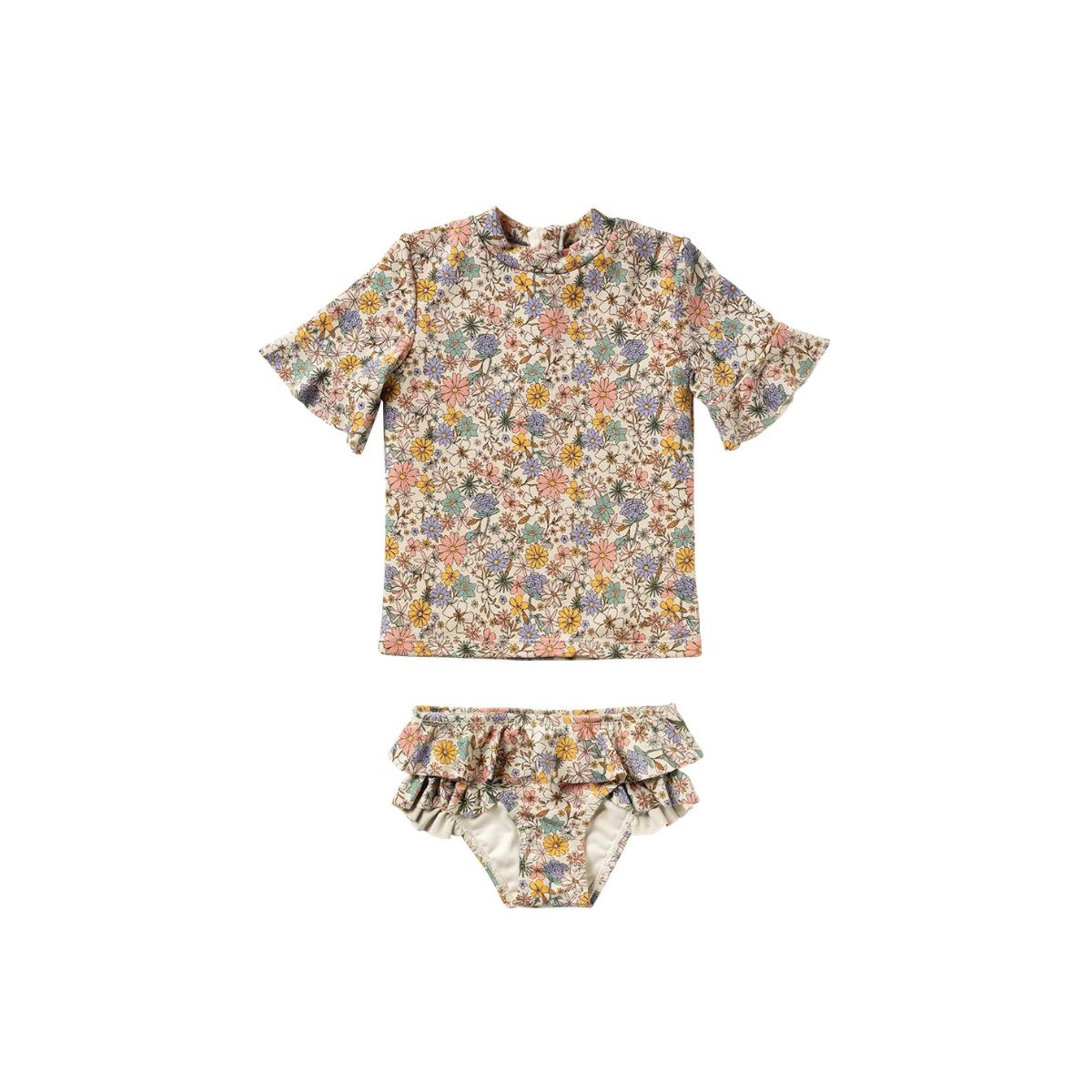 Het Salted Stories sparkly fleurs zwemsetje bestaat uit een zwemshirt en een broekje met bloemenprint. Het materiaal biedt bescherming tegen de zon (UPF50+) en droogt snel. VanZus