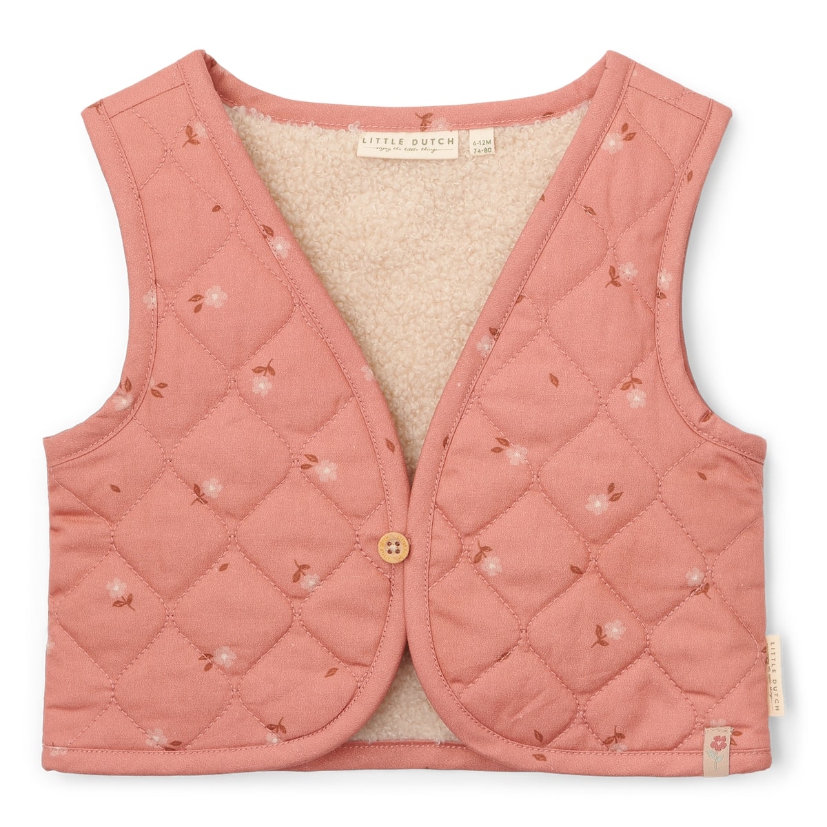 Met het omkeerbaar gilet van Little Dutch in de kleur sand/warm rose blooming flower voeg je een vleugje stijl toe aan de outfit van je kind. Het gilet kan op twee manieren gedragen worden: de kant van de teddystof of de kant met bloemetjesprint. VanZus