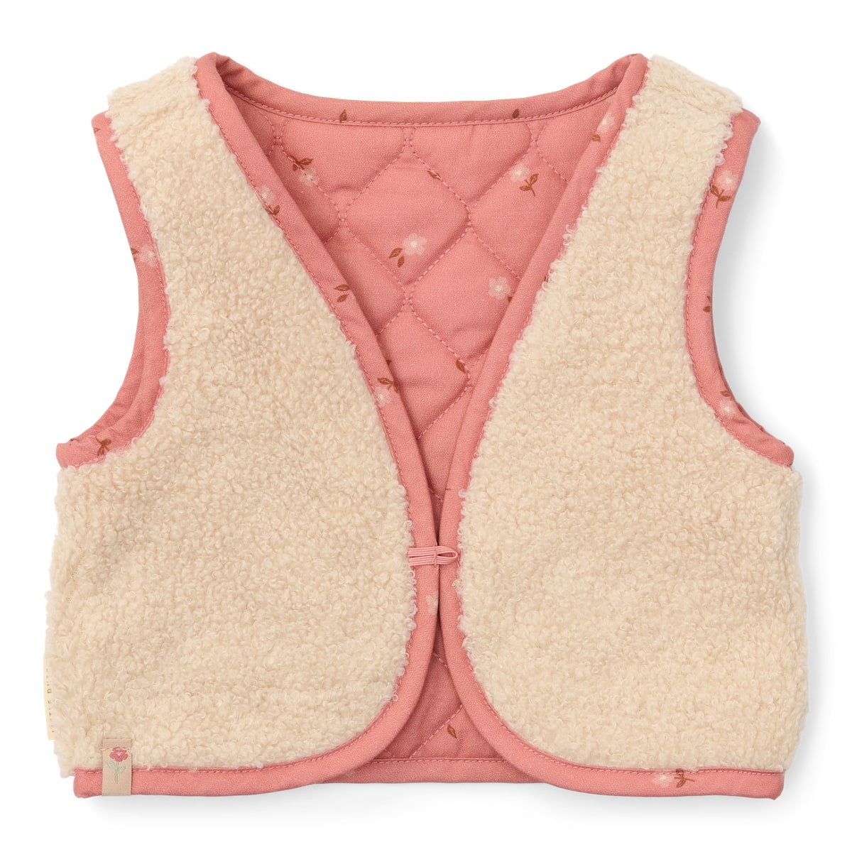 Met het omkeerbaar gilet van Little Dutch in de kleur sand/warm rose blooming flower voeg je een vleugje stijl toe aan de outfit van je kind. Het gilet kan op twee manieren gedragen worden: de kant van de teddystof of de kant met bloemetjesprint. VanZus