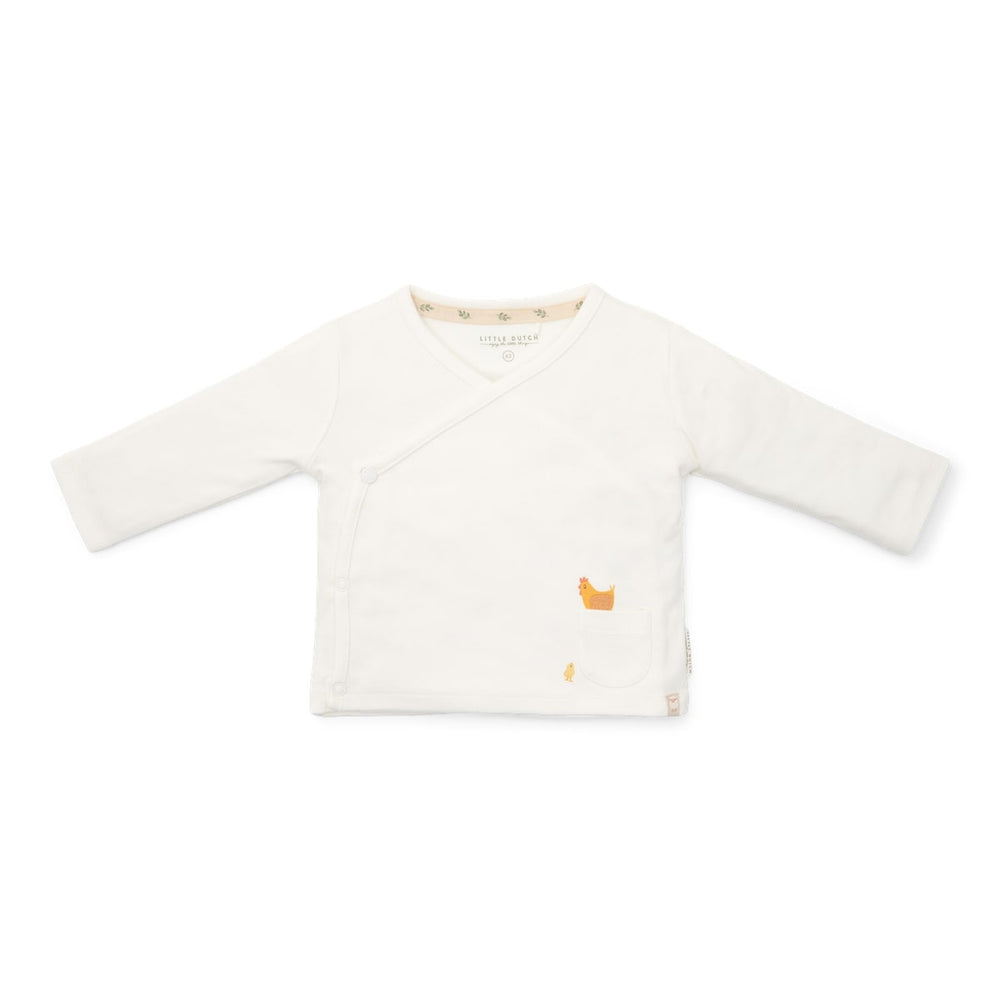 Hoe leuk is dit overslag t-shirt met lange mouw in de kleur off white van Little Dutch? Dit zachte en comfortabele shirt is gemaakt van biologisch katoen en voelt fijn aan op de huid. VanZus