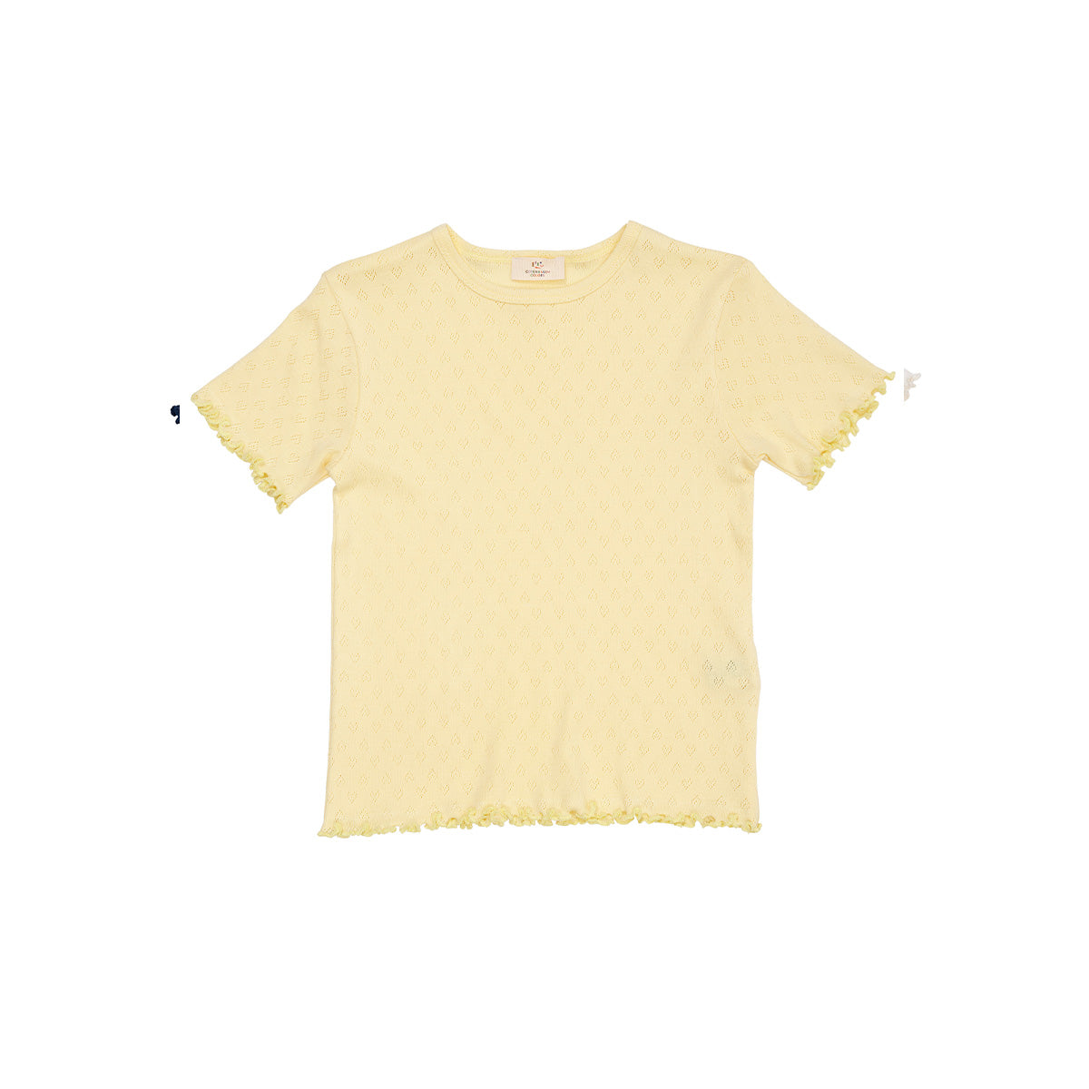 Een musthave: het pointelle heart t-shirt in kleur pale yellow van Copenhagen Colors. Een zachte stof met subtiel hartjes motief en golvend randje. Hip! Te koop in maten 80 t/m 128 en diverse kleuren. VanZus