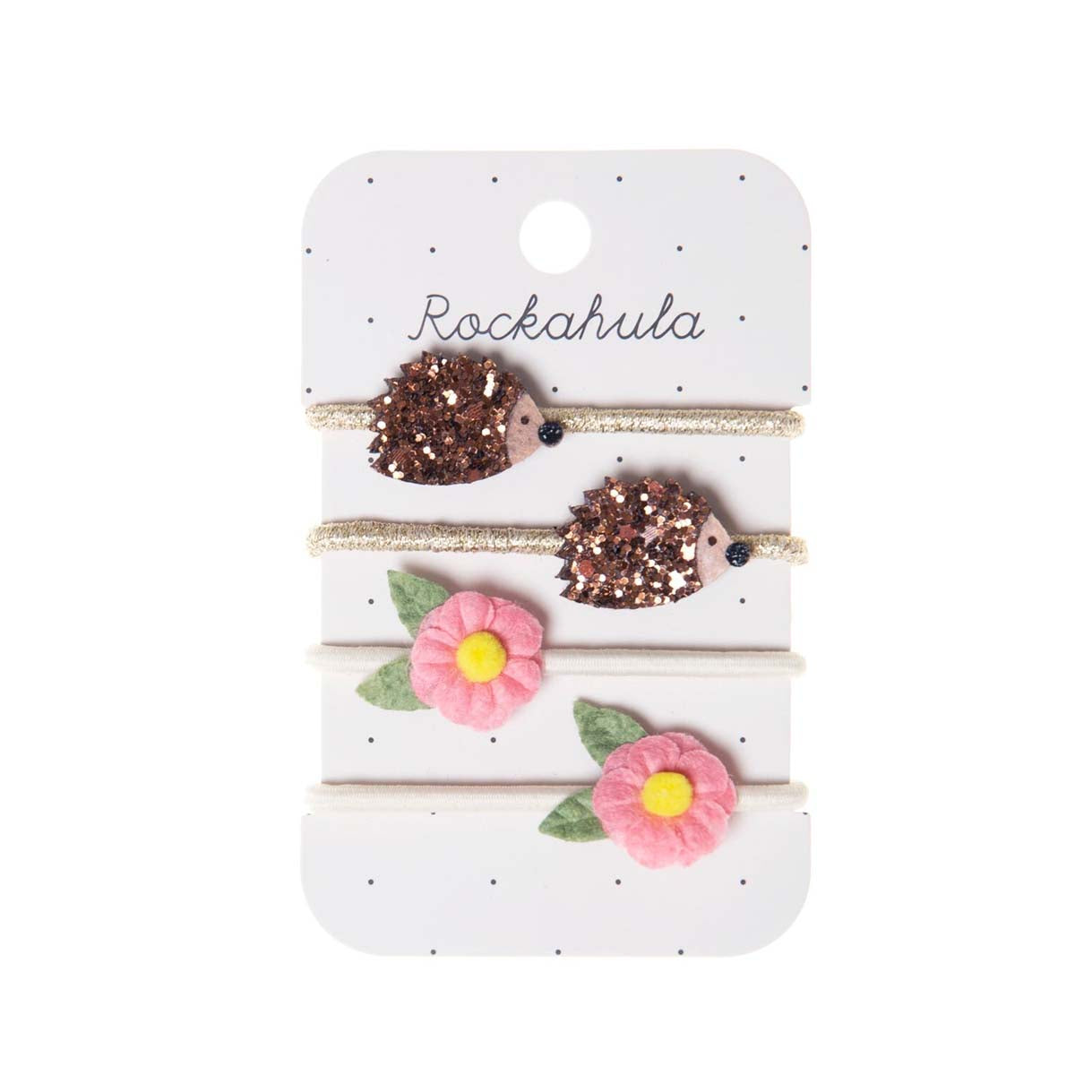 Cuteness overload met Rockahula’s hattie hedgehog elastiekjes! De set bestaat uit 4 elastieken: 2 goudkleurige elastieken met glitter egeltjes en 2 wit gekleurde elastieken met roze bloemen. VanZus