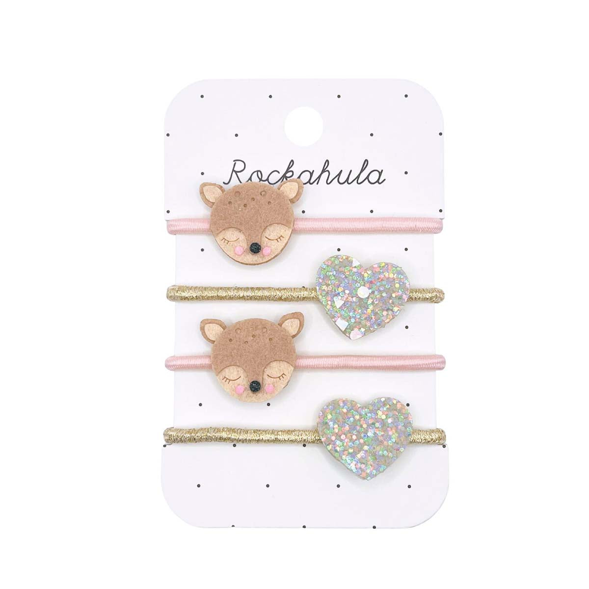 Cuteness overload met Rockahula’s doris deer elastiekjes! De set bestaat uit 4 elastieken: 2 goudkleurige elastieken met glitter hartjes en 2 roze kleurige elastieken met lieve herten hoofdjes. VanZus