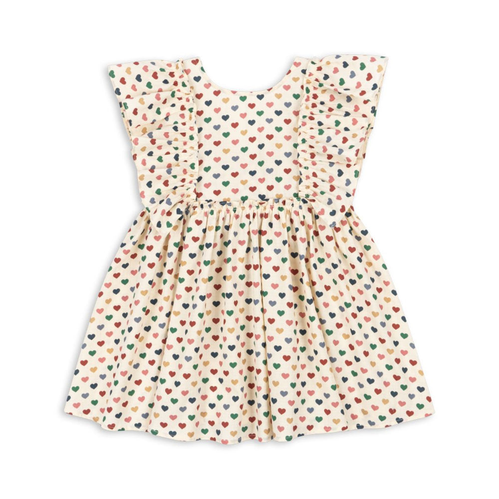 Hoe schattig is deze evia bow jurk in de variant coeur coloré van het merk Konges Slojd? Dit mooie jurkje met een beige kleur en een schattige print van gekleurde hartjes is het ideale jurk voor zowel feestelijke gelegenheden als alledaagse outfits. VanZus