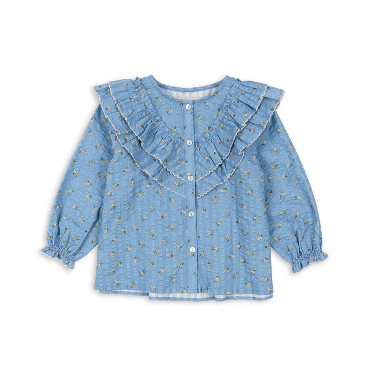 De Konges Slojd kim ruches blouse billie blue is een stijlvolle toevoeging aan de kindergarderobe. Gemaakt van zacht, biologisch katoen met schattige ruches en een druivenprint, perfect voor elke gelegenheid!