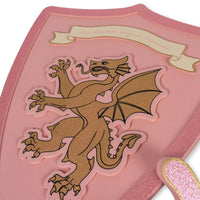 Trotseer draken en vecht met ridders met deze geweldige prinsessen zwaard en schild set in de variant pink glitter van het merk Konges Slojd. VanZus