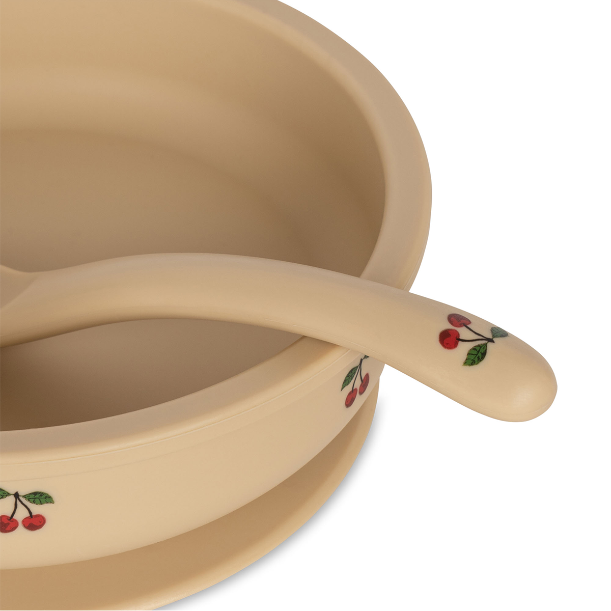 Maak het eten een feestje met deze leuke kom en lepel set van Konges Slojd! De set is gemaakt van siliconen en is ideaal voor kleine kindjes om zelf te leren eten. De kom is aan de onderkant voorzien van een zuignap, waardoor de kom stevig op zijn plek blijft staan en knoeigevaar wordt geminimaliseerd. VanZus