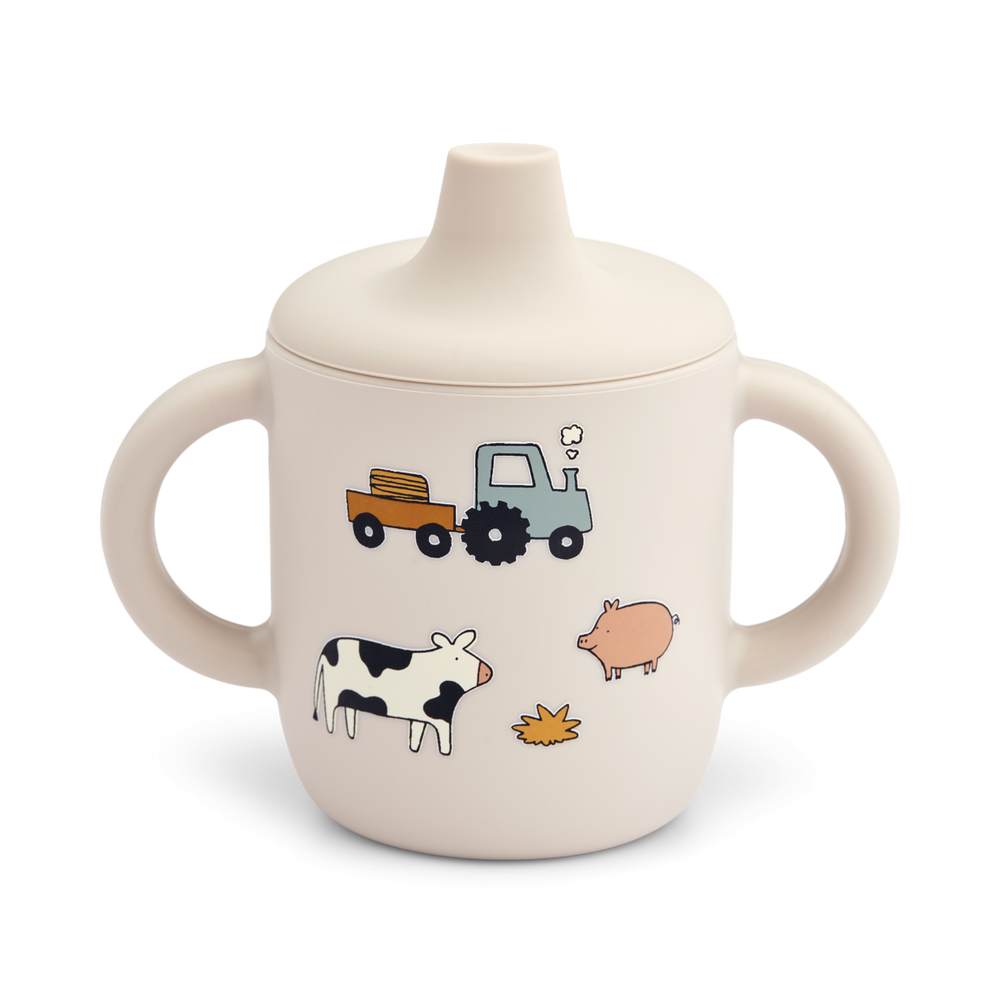 Zelf leren drinken doe je met deze neil sippy cup in de kleur farm/sandy van het merk Liewood. Deze mooie beker is ideaal voor je kindje om zelf te leren drinken, ligt lekker in de hand en ziet er ook nog eens leuk uit! VanZus