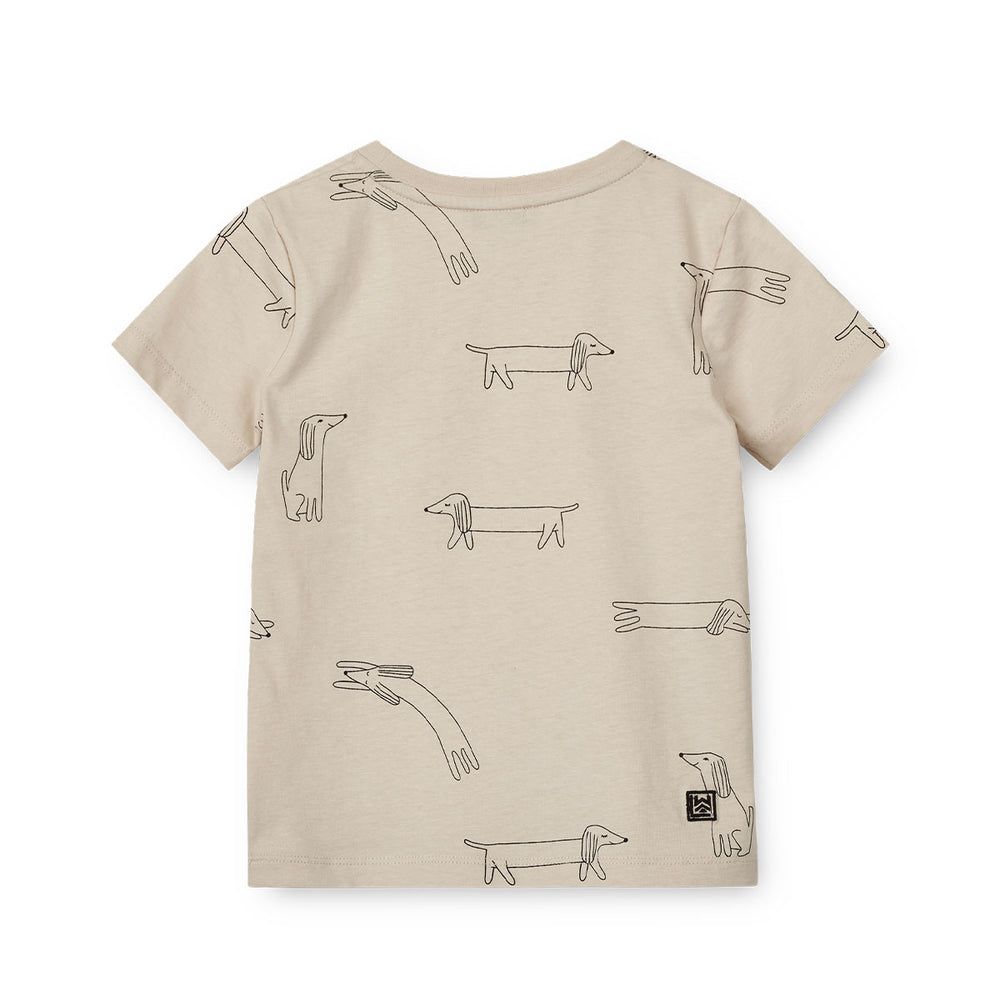 Verrijk de garderobe van je kind met dit schattige apia T-shirt in de kleur dog/sandy van het merk Liewood. Dit stijlvolle shirtje ziet er niet alleen geweldig uit, maar zit ook heel erg comfortabel! VanZus