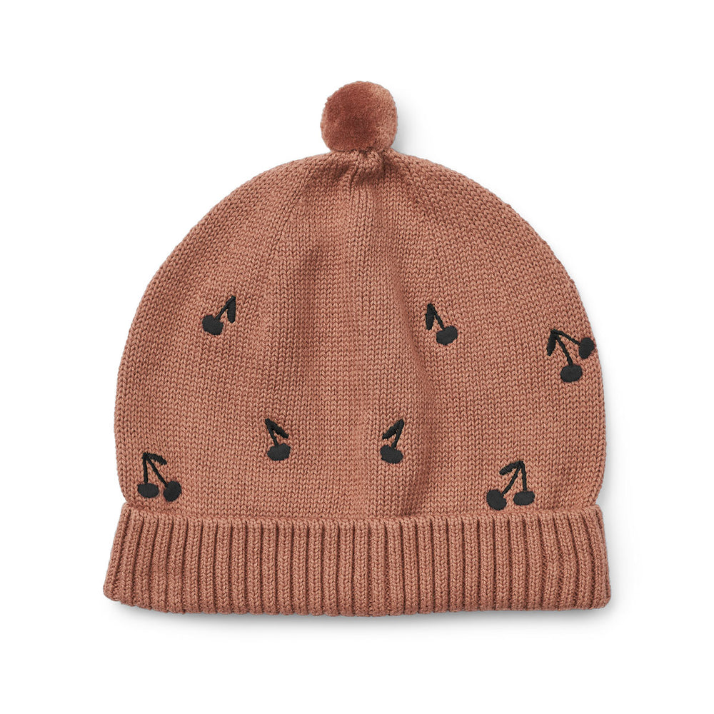 Houd het hoofd en de oren van je kindje lekker warm met deze te gekke aster beanie in de kleur cherries/dark rosetta van het merk Liewood. Deze heerlijk warme muts is niet alleen handig voor de koude wintermaanden, maar ziet er ook geweldig uit! VanZus