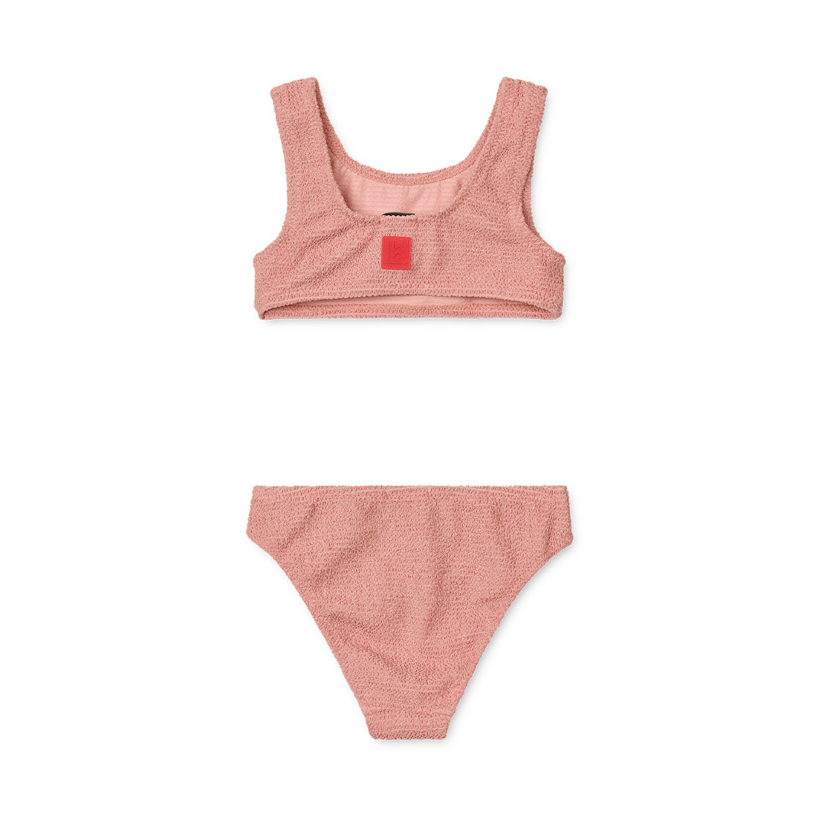 Laat je kleintje stralen deze zomer met deze bello bikini in de variant dusty rose van het vrolijke merk Liewood. Deze stijlvolle bikini is gemaakt van duurzame, gerecyclede materialen en biedt ultiem comfort tijdens het spelen en zwemmen. VanZus