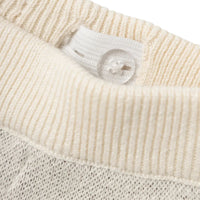 Comfortabel en duurzaam: Lil' Atelier baby lamoe knit broek in birch, gemaakt van 100% biologisch katoen, perfect voor de herfst/winter. Met verstelbare taille, all-over print van honden en geribde zoom. VanZus