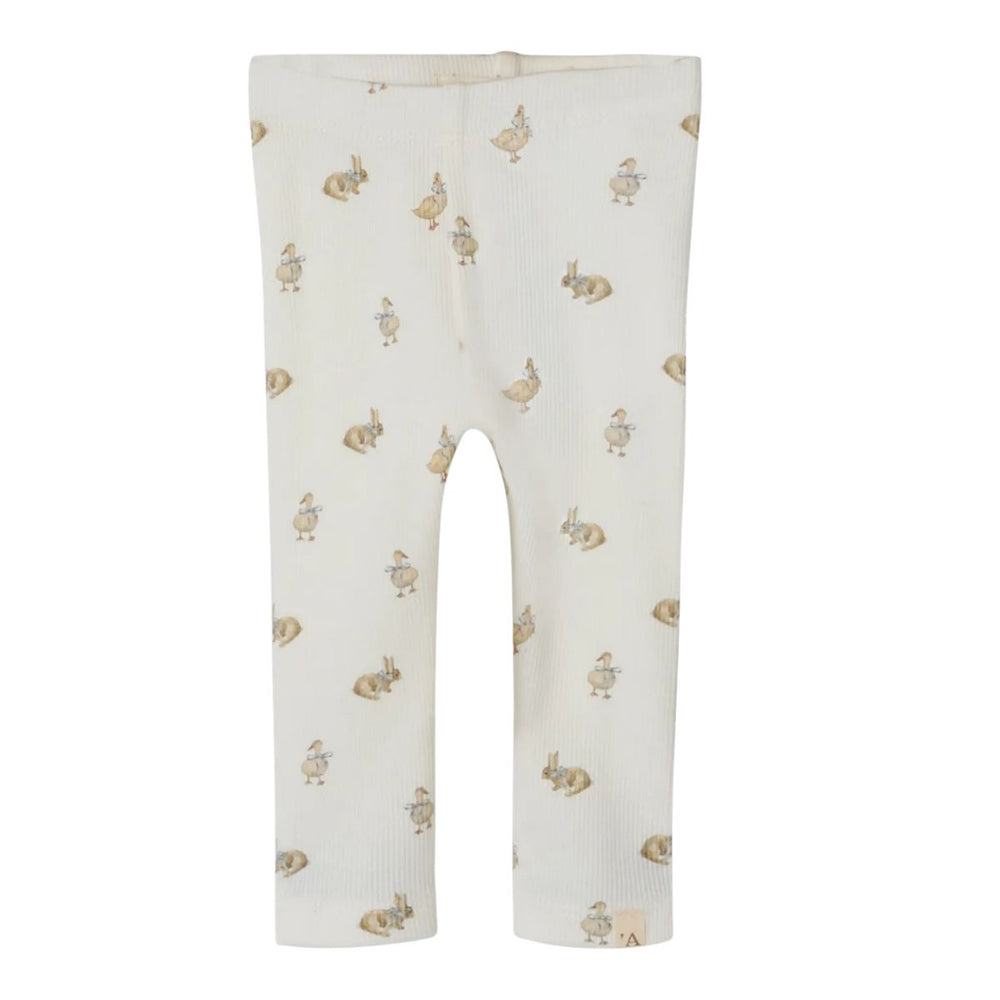 De baby lavo slim legging in coconut milk van het merk Lil' Atelier is comfortabel, slim fit, met elastische taille en vrolijke print. Combineer met bijpassende romperjurk. VanZus