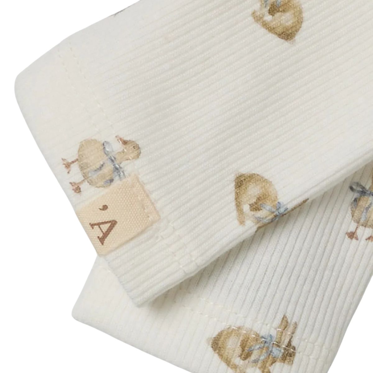 De baby lavo slim legging in coconut milk van het merk Lil' Atelier is comfortabel, slim fit, met elastische taille en vrolijke print. Combineer met bijpassende romperjurk. VanZus