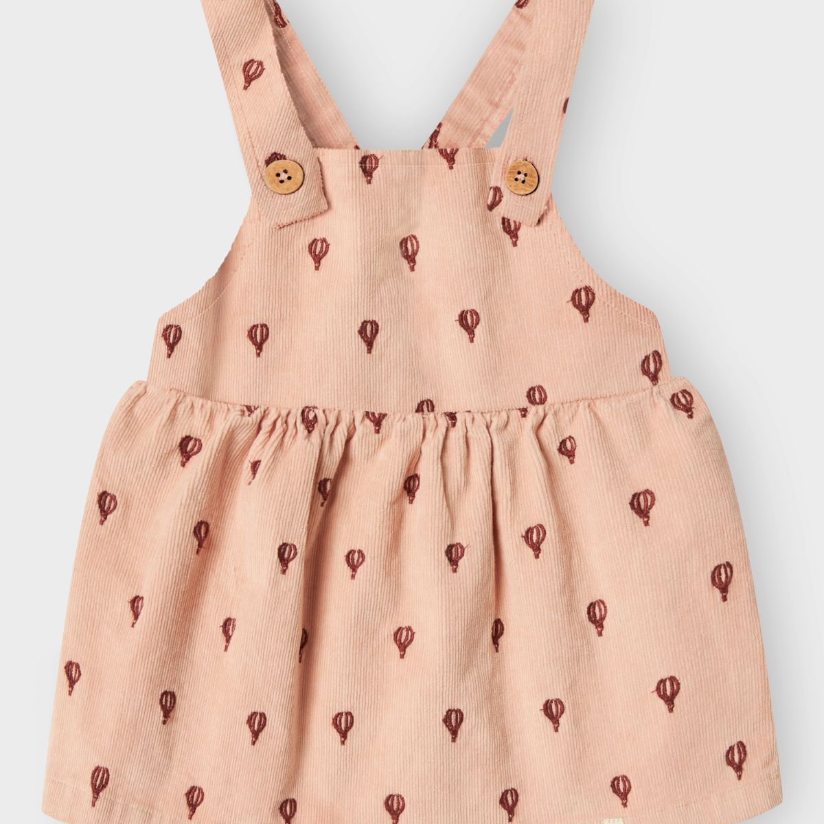 Voeg dit schattige baby nelly corduroy jurkje van Lil' Atelier toe aan de garderobe van je kleintje. Gemaakt van een zacht, geribd katoen, is deze jurk de perfecte mix tussen comfort en stijl. VanZus