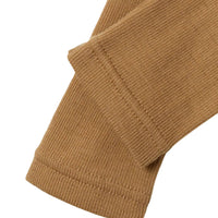 Voor jongens en meisjes: baby noel wol slim legging in tigers eye van het merk Lil' Atelier. 100% merinowol, slim fit, met elastische taille. Perfect voor elk seizoen. VanZus