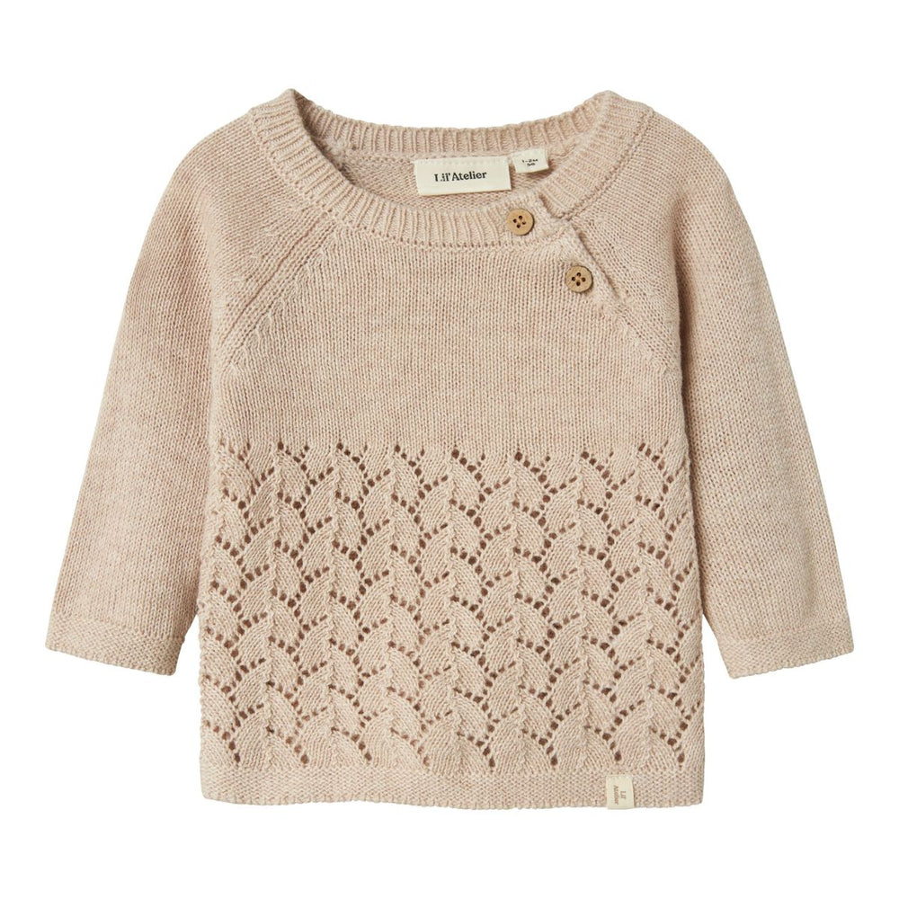 Het baby olga knit shirt in de kleur pastel parchment van het merk Lil' Atelier is een must-have voor elke kindergarderobe. VanZus