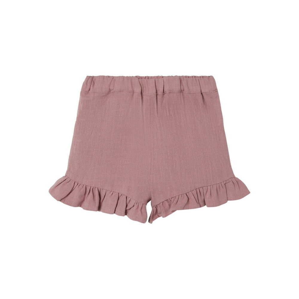 Dit schattige roze nostalgia rose broekje van het merk Lil' Atelier wordt sowieso een favorietje van jouw kleintje. Dit broekje is enorm veelzijdig en is een echte eyecatcher, dankzij de mooie kleur en de schattige details. VanZus