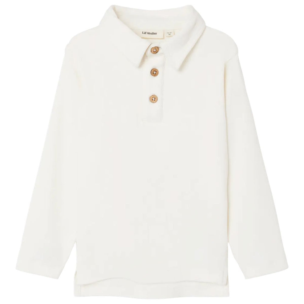 Lil' Atelier fundo slim polo in coconut milk, een stijlvolle top voor jongens. Gemaakt van biologisch katoen en TENCEL™ voor comfort en duurzaamheid. Perfect voor elke gelegenheid. VanZus