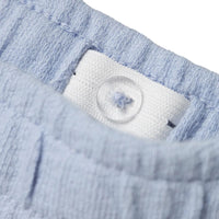 Lil' Atelier jollo sweat short in zen blue, gemaakt van 100% biologisch katoen. Regular fit met verstelbare taille en zijzakken, perfect voor een comfortabele en trendy look. VanZus