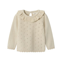 Het laguna knit shirt in de mooie kleur turtledove van het merk Lil' Atelier is een stijlvolle en comfortabele keuze voor elk kind. Deze pullover is gemaakt van 100% biologisch katoen, wat zorgt voor een zachte en huidvriendelijke ervaring. VanZus
