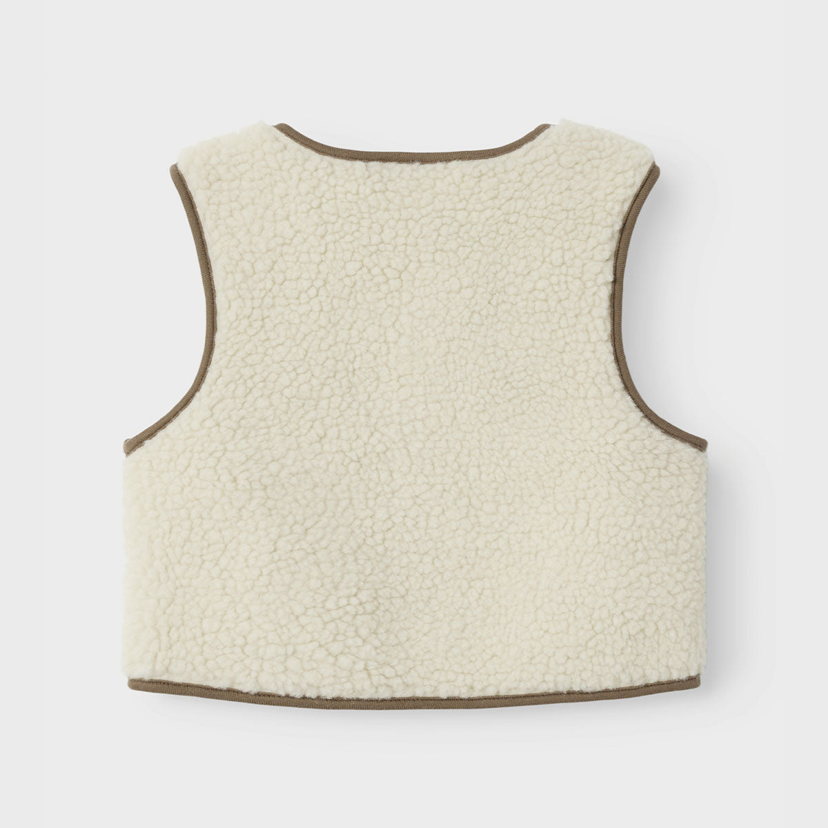 Stijl de look van jouw mini af met de heerlijk zachte lajo baby bodywarmer van het merk Lil' Atelier. VanZus