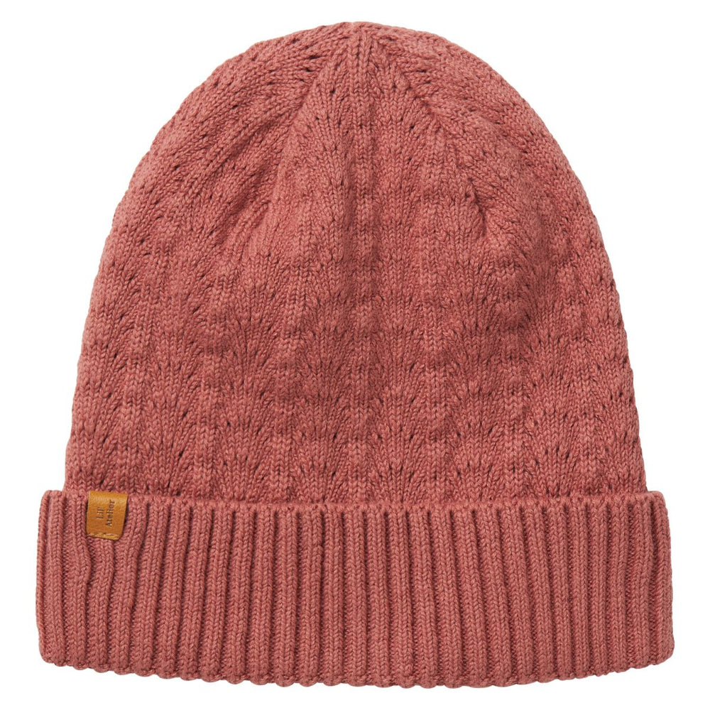De Lil' Atelier nalu knit muts in de kleur withered rose is de perfecte finishing touch voor de winteroutfit van je kleintje. De muts is gemaakt van een zachte gebreide stof en houdt het hoofdje lekker warm tijdens de koude dagen. VanZus