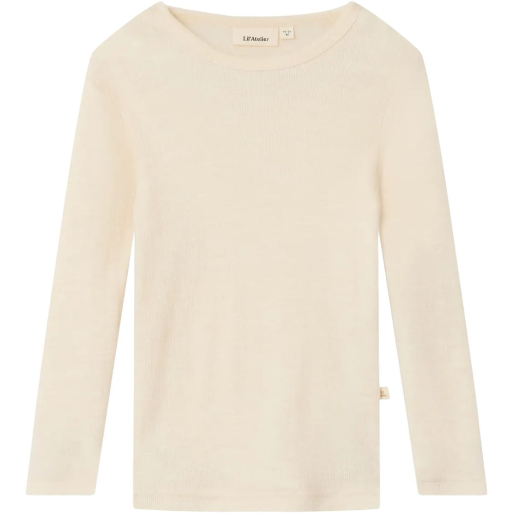 Het Lil' Atelier nalu slim boy shirt in turtledove melange is unisex, gemaakt van zachte merinowol en TENCEL™, biedt comfort en stijl voor je kind tijdens de herfst en  winter. VanZus
