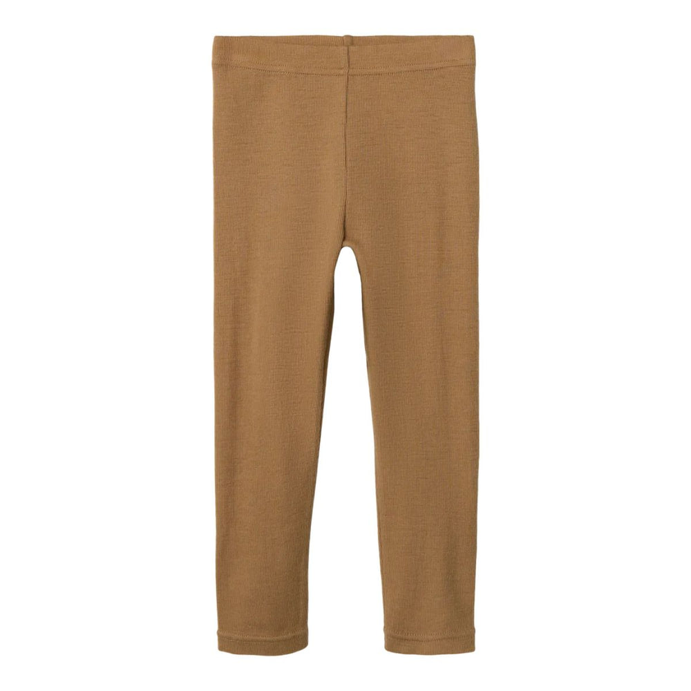 Kies voor de Lil' Atelier noel wol slim legging in de variant tigers eye. Deze vrouwelijke legging van 100% merinowol biedt warmte en stijl voor je kind in de herfst en winter! VanZus