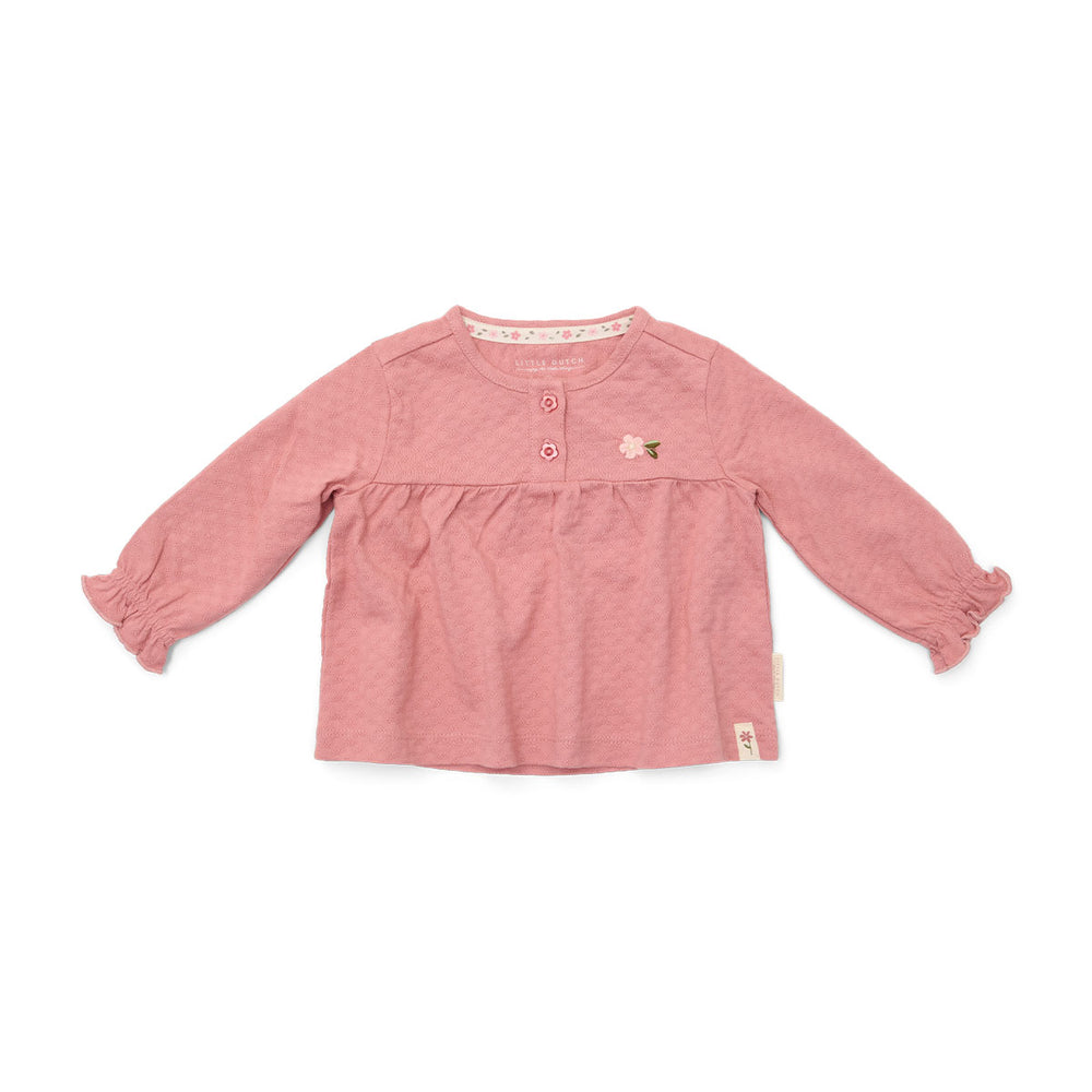 Comfortabele en basic t-shirts zijn altijd fijn om in de kast te hebben hangen! Dat geldt al helemaal voor dit lieve t-shirt lange mouw in de variant pink blush van het merk Little Dutch. Dit schattige shirt is de ideale basic om de leukste outfits mee samen te stellen. VanZus