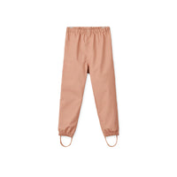 Hijs je kindje in deze coole pedia broek in de kleur tuscany rose en de regenpret kan beginnen! Deze broek van het merk Liewood is ideaal voor op regenachtige dagen! Deze broek is water- en winddicht, heeft verstelbaar elastiek bij de taille zodat hij altijd goed zit en heeft een mooie oranje kleur. VanZus