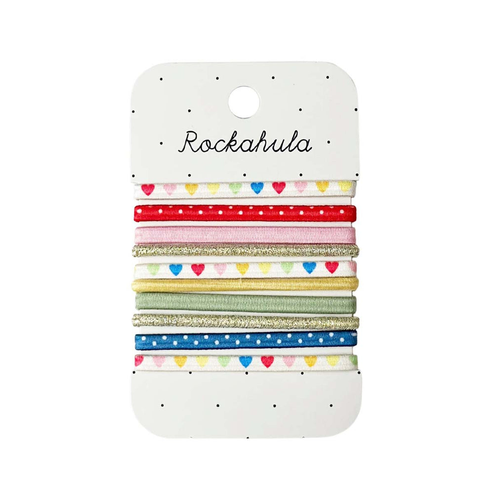 Een vrolijke set van 10 fel gekleurde elastieken: de rainbow hearts van Rockahula. Mix & match. Met o.a. polkadot en hartjes print in verschillende kleuren. Vanaf 3 jaar. VanZus