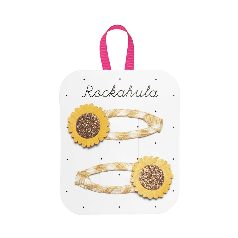 Houd de haren uit het gezicht van jouw mini met deze vrolijke sunflower 2-pack speldjes van het merk Rockahula. Hip en functioneel. Geschikt vanaf 3 jaar. VanZus 