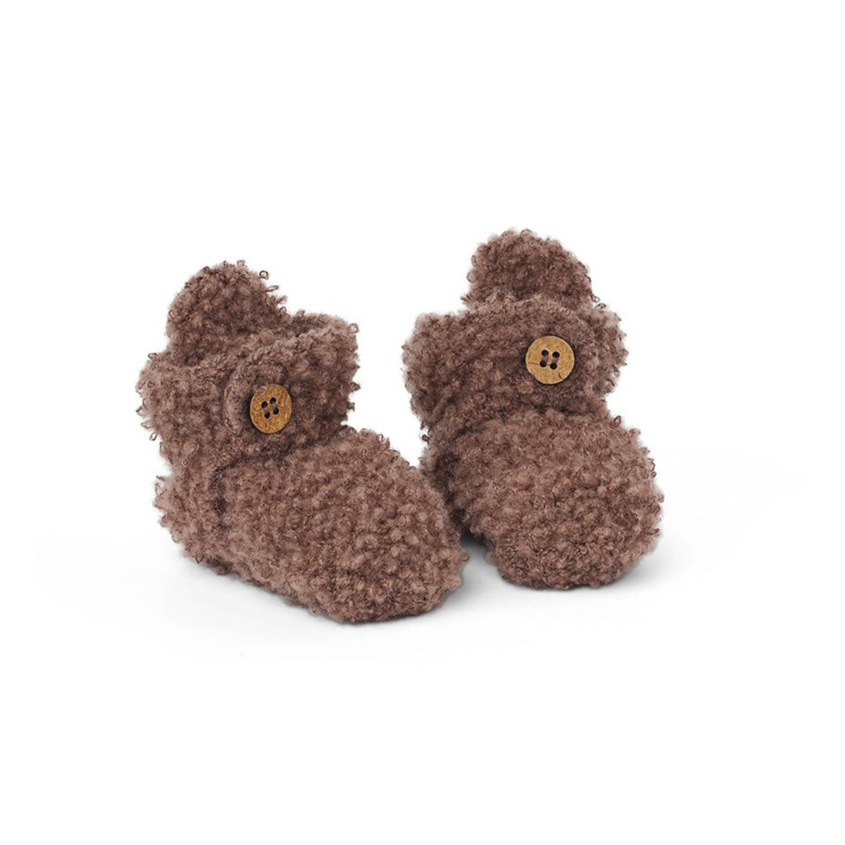 Je kleintje is gegarandeerd van warme voetjes met deze te lieve merinowol bouclé booties in de kleur rose brown van het merk Smallstuff. Deze schattige slofjes zijn gemaakt van 100% zacht merinowol en hebben elastiek bij de enkel, waardoor ze super comfortabel zitten. VanZus