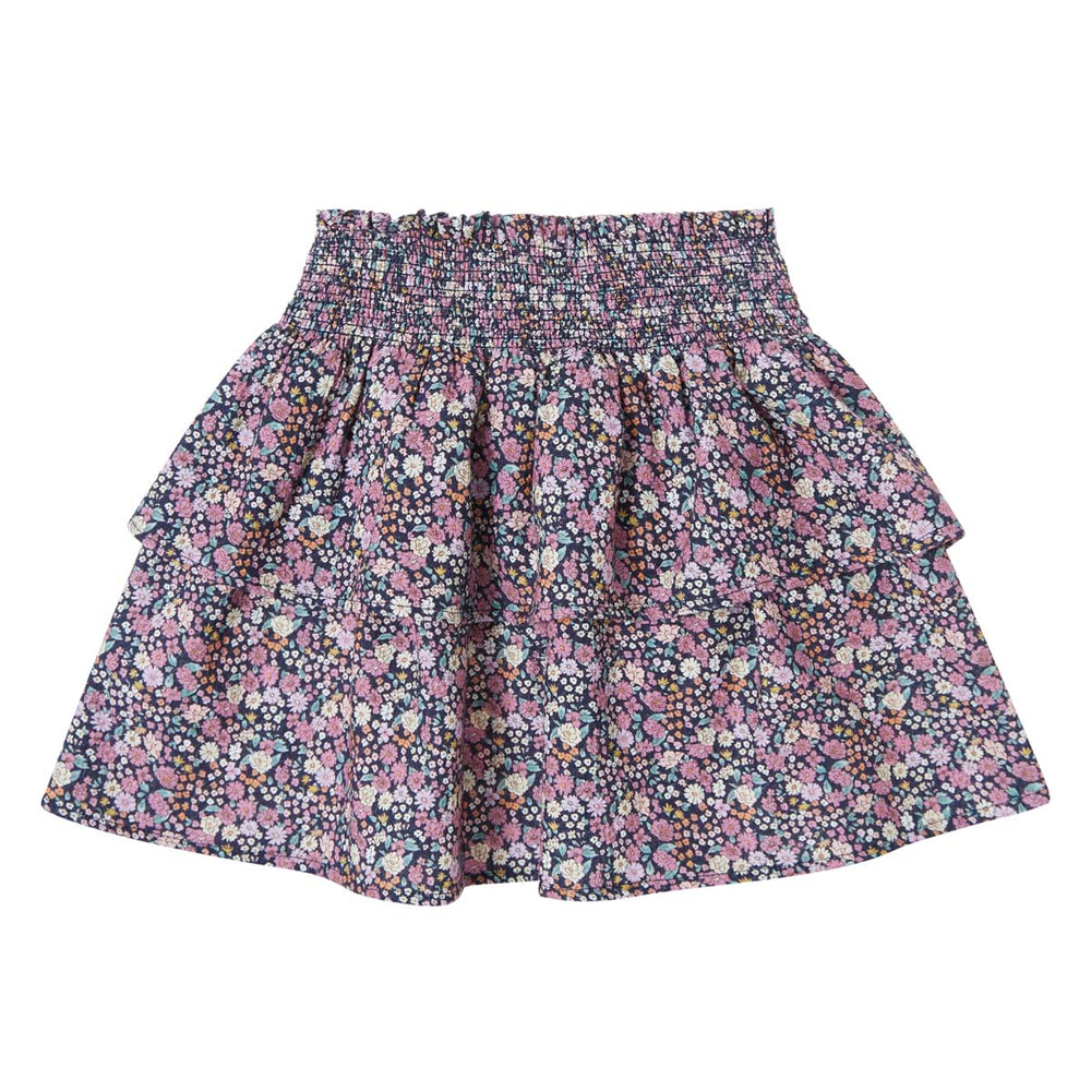 Vrolijk & hip: het flared rokje flowers in de kleur navy van het Spaanse merk Tocoto Vintage. De mini rok heeft schattige ruches aan de onderkant en een lieve bloemenprint. In de maten 98 t/m 140. VanZus