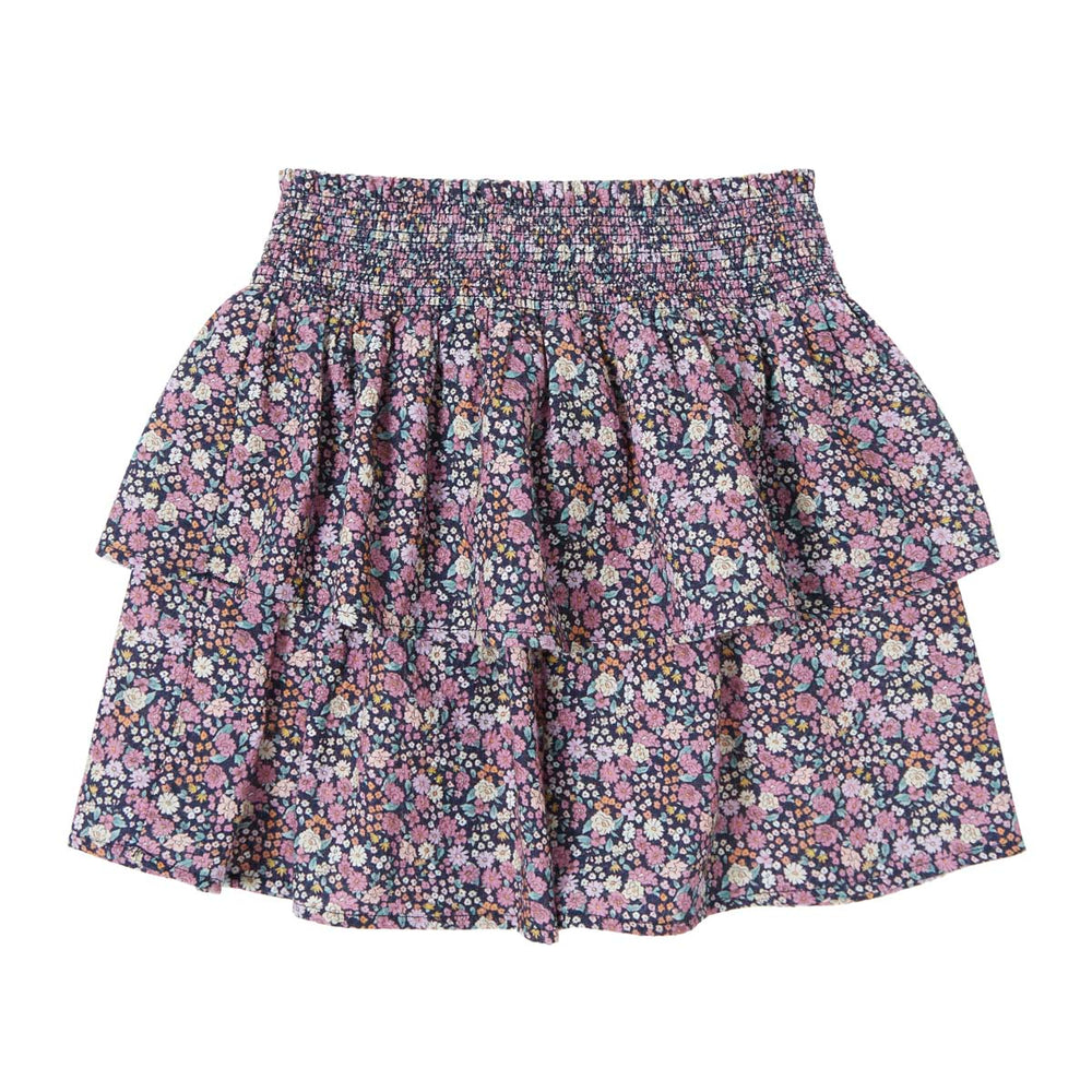 Vrolijk & hip: het flared rokje flowers in de kleur navy van het Spaanse merk Tocoto Vintage. De mini rok heeft schattige ruches aan de onderkant en een lieve bloemenprint. In de maten 98 t/m 140. VanZus