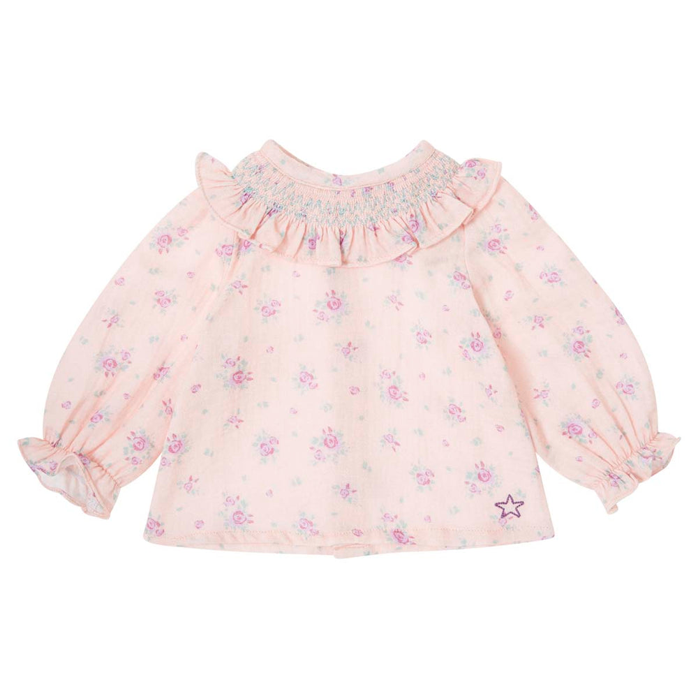 De baby blouse flowers pink van het merk Tocoto Vintage is zacht, comfortabel en heeft een klassieke uitstraling. Met knoopjes aan de achterkant, bloemenprint en ruches. In maten 68 t/m 92. VanZus