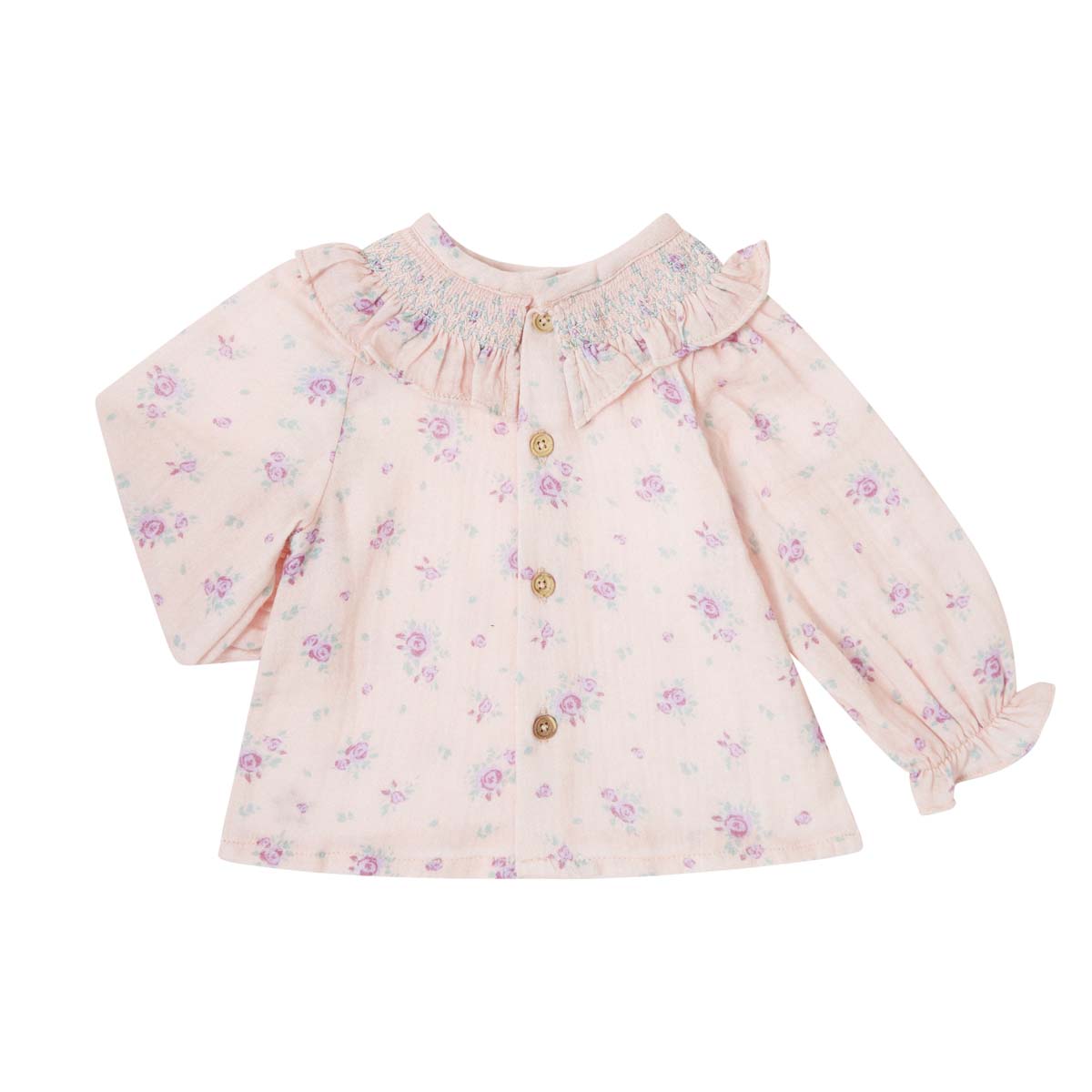 De baby blouse flowers pink van het merk Tocoto Vintage is zacht, comfortabel en heeft een klassieke uitstraling. Met knoopjes aan de achterkant, bloemenprint en ruches. In maten 68 t/m 92. VanZus