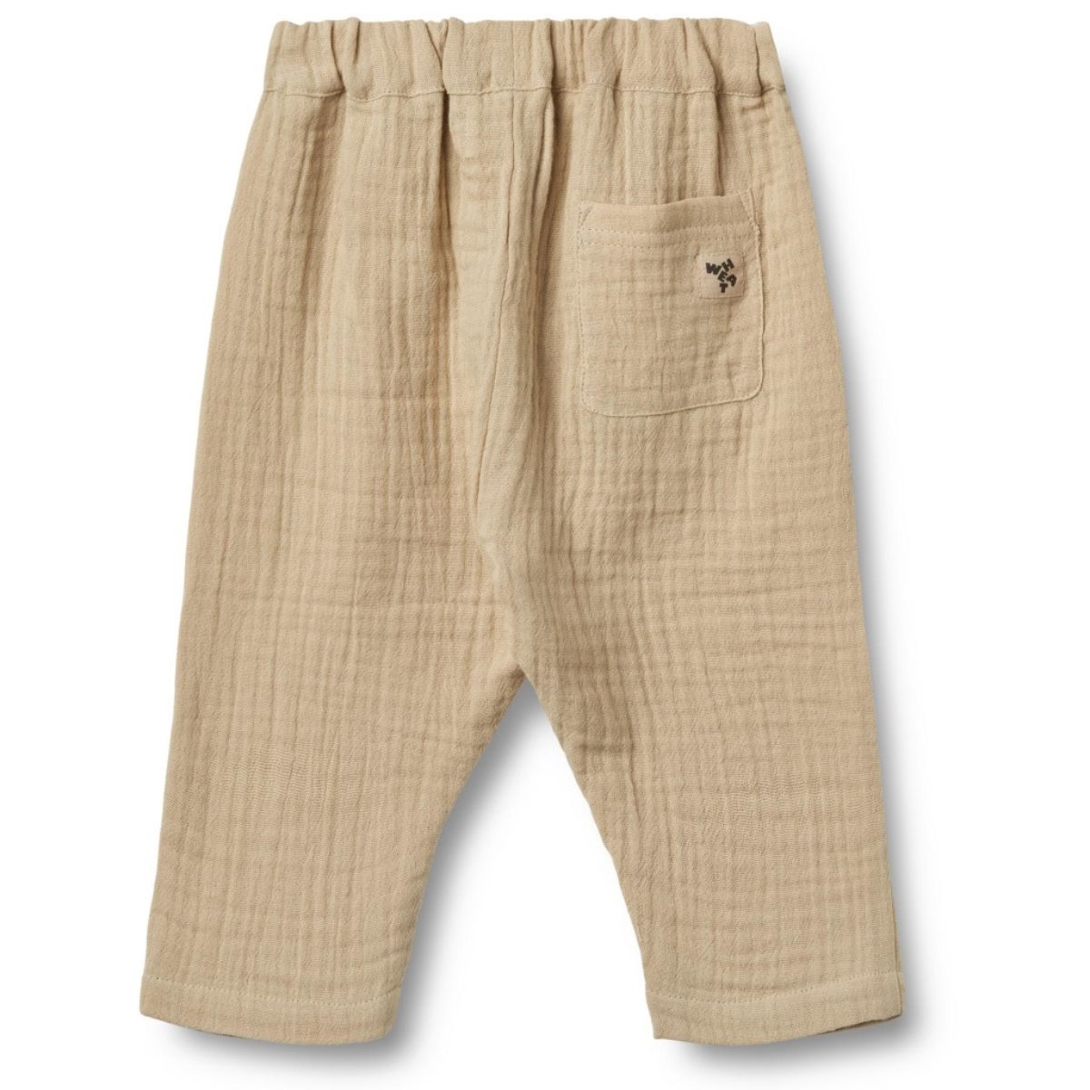 De Wheat ashley broek in de kleur soft sand is een heerlijke zachte broek voor je kleintje. Hij is gemaakt van biologisch katoen en lekker luchtig, perfect voor een lente- of zomerdag. VanZus.