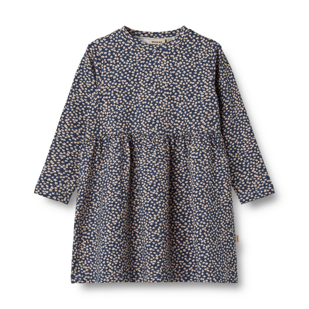 De schattige jurk sessa jersey in de kleur blue flowers van Wheat is een heerlijke jurk voor je kind! VanZus