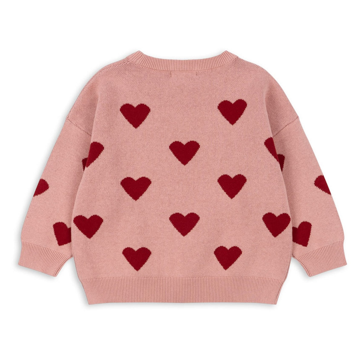 Wat zal je kindje er schattig uitzien in de gebreide trui lapis in de variant mellow rose van Konges Slojd!  Het gebreide shirt heeft een mooie roze kleur en ingebreide hartjes. De pasvorm is ruim en los vallend, mede door de wat afhangende schouders. VanZus