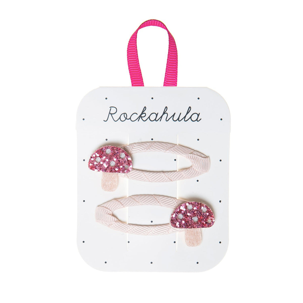 Heb je de little toadstool speldjes van Rockahula al gezien? Glinsterende roze paddenstoeltjes met een viltkleurige stengel stelen de show in de haren van jouw mini. Een hip en vrolijk haaraccessoire! VanZus