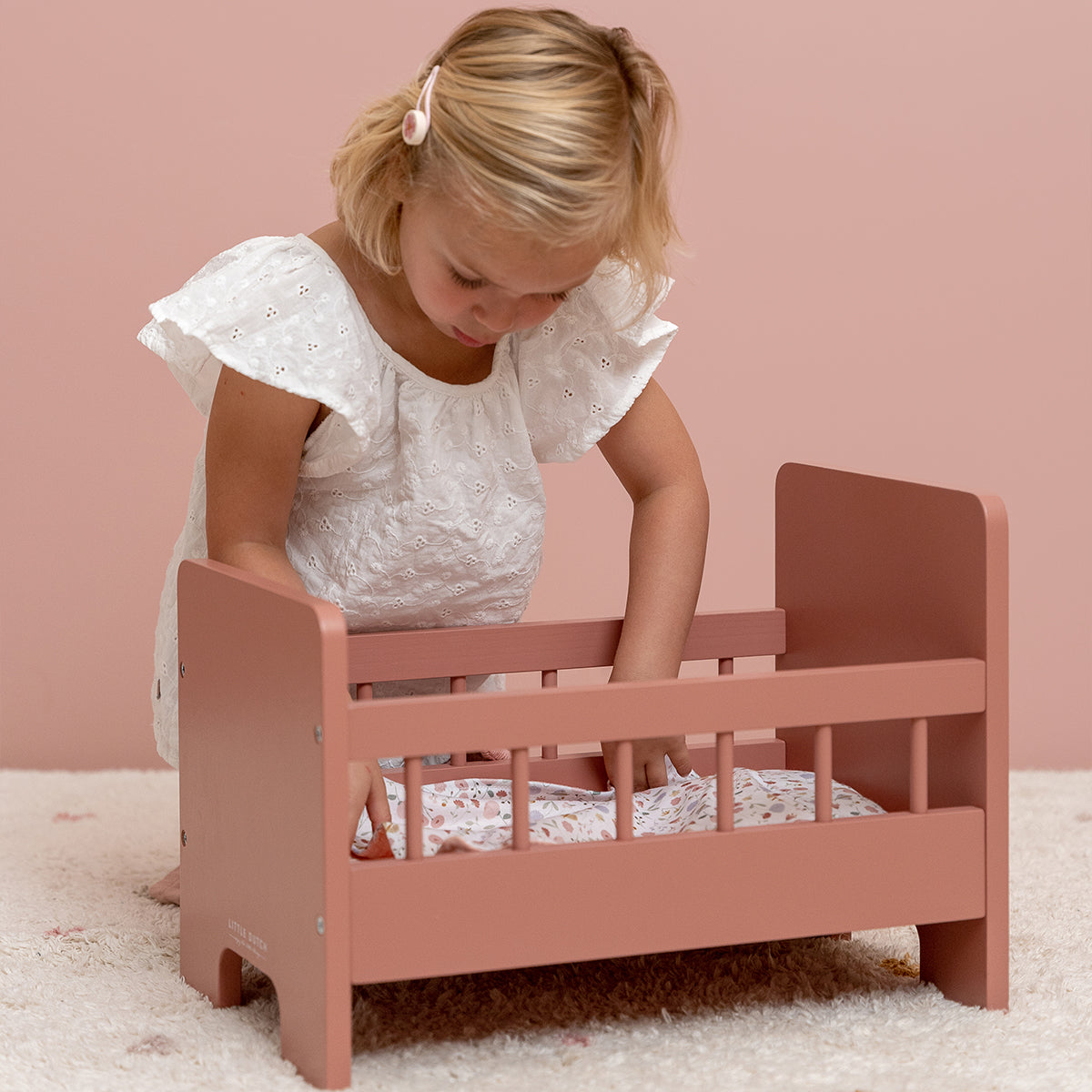 Little Dutch doll bed with pink textile