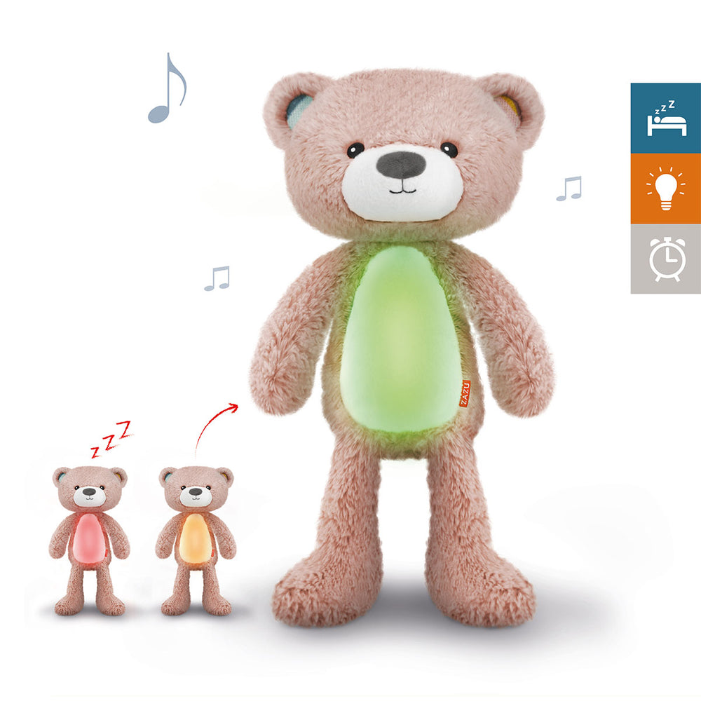 De ZAZU Slaaptrainer Brody the bear pink is een nachtlamp in de vorm van een blauwe knuffelbeer met timer en muziek. Een handig hulpmiddel voor kinderen om ze te leren wanneer het dag-nacht/bedtijd-speeltijd is. VanZus.