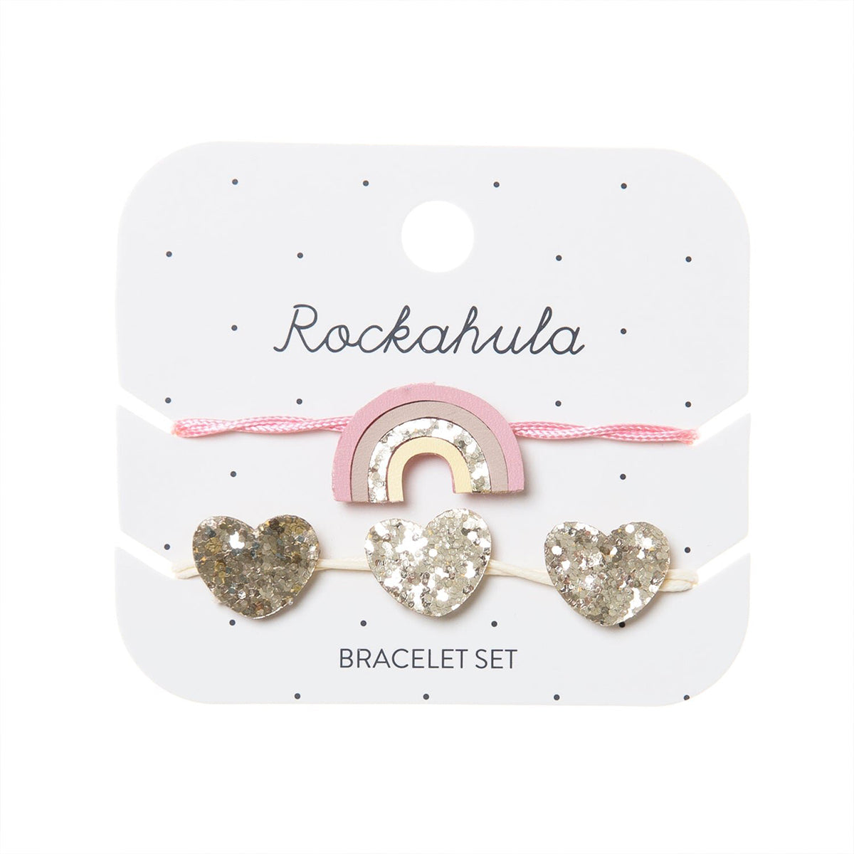 Armcandy voor jouw mini: de Rockahula magical rainbow armbandjes set. Een armbandje met regenboog in de kleuren roze en goud en een armbandje met gouden glinsterende harten. Eenvoudig verstelbaar. VanZus